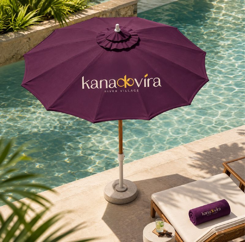 Kanakvira logo on a plum poolside umbrella