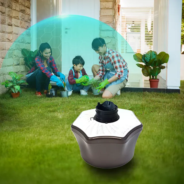 Mosquito trap on a lawn where a family gardens together. Mosquito Free World Google Ads creative by Sigil Advertising.